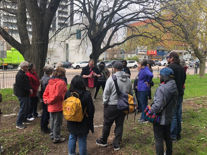 A group of people gathered for Jane's Walk tour in Willowdale, Ontario.